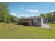 This home has a large wooden deck, perfect for outdoor entertaining, with a spacious yard at 2816 Pine Meadow Dr, Marietta, GA 30066
