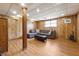 Finished basement featuring cozy seating area with wood-paneled walls and laminate flooring at 2816 Pine Meadow Dr, Marietta, GA 30066