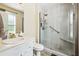 Bright bathroom with a modern shower featuring glass doors and built-in shelving at 2816 Pine Meadow Dr, Marietta, GA 30066
