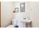 Simple half-bathroom featuring a pedestal sink and toilet at 2816 Pine Meadow Dr, Marietta, GA 30066