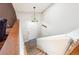 Light and bright entryway with wood stairs and a stylish, decorative pendant light fixture at 2816 Pine Meadow Dr, Marietta, GA 30066