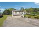 Charming home featuring a two-car garage, light siding, green shutters, and a well-maintained front yard at 2816 Pine Meadow Dr, Marietta, GA 30066