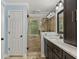 Modern bathroom featuring glass enclosed shower, granite countertop and bronze hardware at 305 Spindle Ct, Sandy Springs, GA 30350
