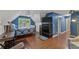 Spacious bedroom with hardwood floors, desk, and sitting area at 305 Spindle Ct, Sandy Springs, GA 30350