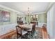 Elegant dining room with hardwood floors, chandelier, and access to an adjacent dining space at 305 Spindle Ct, Sandy Springs, GA 30350