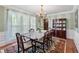 Bright dining room with hardwood floors, a chandelier, and large windows at 305 Spindle Ct, Sandy Springs, GA 30350