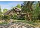 Charming two-story home with a well-manicured front yard and lovely stone walkway at 305 Spindle Ct, Sandy Springs, GA 30350