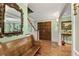 Inviting foyer with hardwood floors, classic trim, and a decorative mirror on the wall at 305 Spindle Ct, Sandy Springs, GA 30350