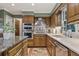 Well-appointed kitchen featuring custom cabinetry, stainless steel appliances, and brick flooring at 305 Spindle Ct, Sandy Springs, GA 30350