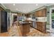 Spacious kitchen featuring stainless steel appliances, wooden cabinets, and an island prep area at 305 Spindle Ct, Sandy Springs, GA 30350