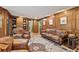 Spacious living room with built-in shelving, hardwood floors, and comfortable seating at 305 Spindle Ct, Sandy Springs, GA 30350