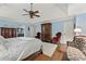 Comfortable main bedroom with hardwood floors, custom furniture, and an ensuite bath at 305 Spindle Ct, Sandy Springs, GA 30350