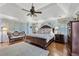 Spacious main bedroom with hardwood floors, tray ceilings, and custom accent decor at 305 Spindle Ct, Sandy Springs, GA 30350