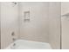 Tiled shower-tub with tiled nook is perfect for storing shower essentials at 790 Riverwood Pass, Dallas, GA 30157