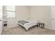 This bedroom has neutral carpet and a large window for tons of natural light at 790 Riverwood Pass, Dallas, GA 30157