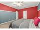 Spacious bedroom with ceiling fan and carpeted floors at 790 Riverwood Pass, Dallas, GA 30157