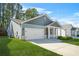Charming single-Gathering home with a two-car garage, a covered porch, and landscaped front yard at 790 Riverwood Pass, Dallas, GA 30157