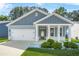 Charming single-Gathering home with a two-car garage, a covered porch, and landscaped front yard at 790 Riverwood Pass, Dallas, GA 30157