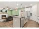 Open-concept kitchen with granite countertops, stainless steel appliances, and an eat-in island at 790 Riverwood Pass, Dallas, GA 30157