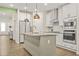 Gourmet kitchen features modern stainless appliances and center island at 790 Riverwood Pass, Dallas, GA 30157