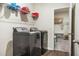 Laundry room with newer appliances and storage shelves is a dream at 790 Riverwood Pass, Dallas, GA 30157
