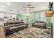Open-concept living space featuring a kitchen, dining area, and living room with stylish decor at 790 Riverwood Pass, Dallas, GA 30157