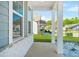 Covered front porch with classic white columns, stone accents, and well-manicured landscaping at 790 Riverwood Pass, Dallas, GA 30157
