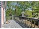 A spacious backyard deck offers tranquil views of the surrounding lush greenery, featuring a charming playhouse at 1195 Oglethorpe Ne Ave, Atlanta, GA 30319