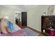 A well-lit bedroom with a comfortable bed, decorative pillows, and hardwood floors, creating a cozy and inviting space at 1195 Oglethorpe Ne Ave, Atlanta, GA 30319