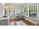 A Bedroom featuring a crib and hardwood floors with plenty of natural light at 1195 Oglethorpe Ne Ave, Atlanta, GA 30319
