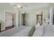 Cozy bedroom showcasing a walk-in closet and ensuite bathroom with light-filled ambiance at 1195 Oglethorpe Ne Ave, Atlanta, GA 30319
