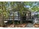 Charming exterior featuring a cozy deck, attractive siding, and a delightful pop of color with the front door at 1195 Oglethorpe Ne Ave, Atlanta, GA 30319