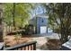 Exterior of home showing a two-car garage, patio, and landscaping, complete with a charming brick walkway at 1195 Oglethorpe Ne Ave, Atlanta, GA 30319