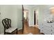 Hallway with hardwood floors, light walls, and a view into other rooms at 1195 Oglethorpe Ne Ave, Atlanta, GA 30319