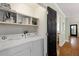 The functional laundry room offers a side-by-side washer/dryer and convenient overhead shelving for storage solutions at 1195 Oglethorpe Ne Ave, Atlanta, GA 30319