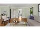 Open living room with hardwood floors, neutral decor, and seamless flow to other rooms at 1195 Oglethorpe Ne Ave, Atlanta, GA 30319
