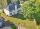 Aerial view of a home with a large yard and partial fence at 1410 White Flowers Ln, Lawrenceville, GA 30045