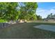 Large backyard with a partial cement patio and a wood fence at 1410 White Flowers Ln, Lawrenceville, GA 30045