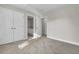 Bedroom with double closets and an open door to the bathroom at 1410 White Flowers Ln, Lawrenceville, GA 30045