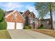 Beautiful two-story brick home with a two car garage and well maintained lawn at 1410 White Flowers Ln, Lawrenceville, GA 30045