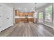 Bright kitchen with wood cabinets, stainless steel appliances, and eat-in area with lots of light at 1410 White Flowers Ln, Lawrenceville, GA 30045
