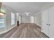 Large living room with lots of open space, hardwood flooring, recessed lighting, and natural light at 1410 White Flowers Ln, Lawrenceville, GA 30045
