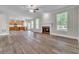 Spacious living room featuring hardwood floors, a fireplace, and an open floor plan at 1410 White Flowers Ln, Lawrenceville, GA 30045