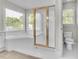 Bright ensuite bathroom with tub and glass door shower at 1410 White Flowers Ln, Lawrenceville, GA 30045