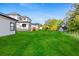 Spacious backyard featuring a large lawn area and views of the home's exterior at 2065 Mozelle Dr, Marietta, GA 30062