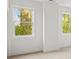 Bright bedroom with natural light from two windows overlooking green scenery at 2065 Mozelle Dr, Marietta, GA 30062