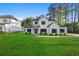Charming two-story home with a landscaped front yard and modern white facade at 2065 Mozelle Dr, Marietta, GA 30062