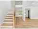 Bright foyer with hardwood floors, staircase and natural light, creating a welcoming entrance at 2065 Mozelle Dr, Marietta, GA 30062