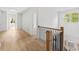 Upstairs hallway with hardwood floors and views to the outside at 2065 Mozelle Dr, Marietta, GA 30062