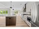 Modern kitchen boasts an island, stainless steel appliances, and elegant countertops for culinary delight at 2065 Mozelle Dr, Marietta, GA 30062